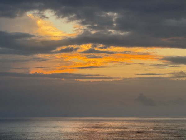Ocean Sunset With Dark Clouds